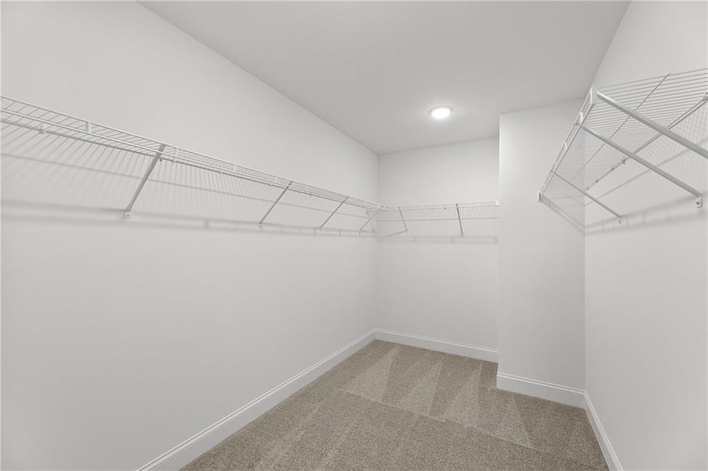 5629 Overview Drive Flowery Branch, GA 30542 - Photo 12 of 25 a view of a room with racks on the wall