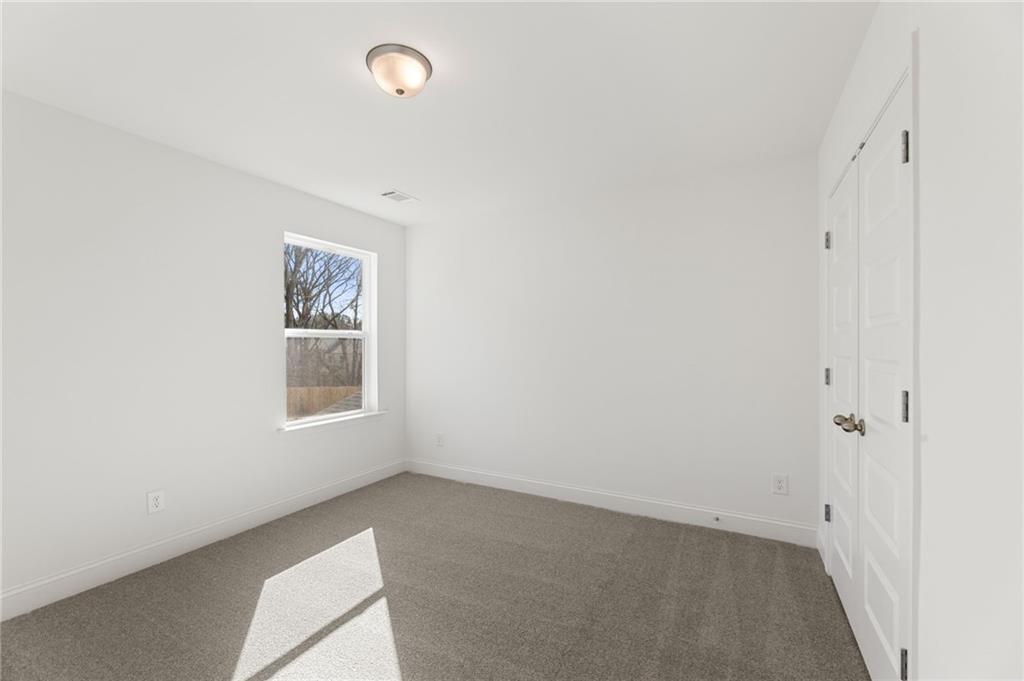 5629 Overview Drive Flowery Branch, GA 30542 - Photo 14 of 25 an empty room with a window