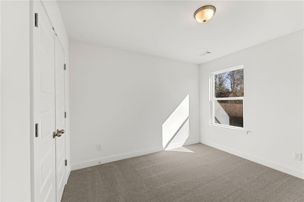 5629 Overview Drive Flowery Branch, GA 30542 - Photo 15 of 25 a view of an empty room with a window