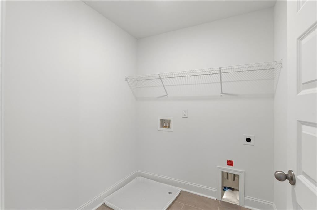 5629 Overview Drive Flowery Branch, GA 30542 - Photo 16 of 25 a view of small space with empty racks on the wall