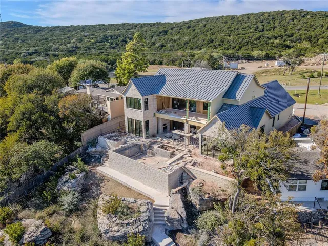 a aerial view of a house with a yard