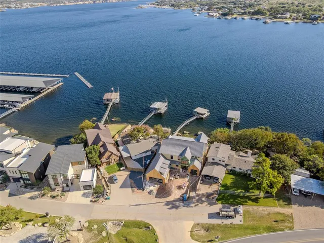 an aerial view of a house with a ocean view