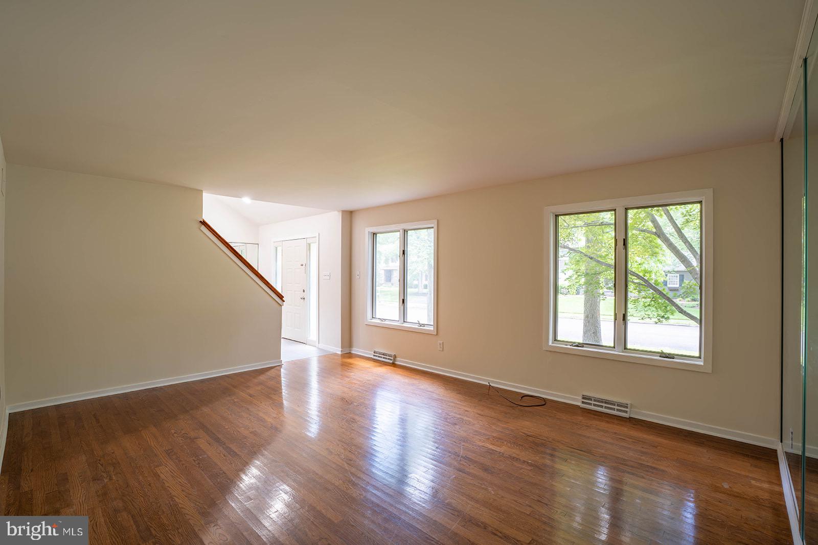 491 Kings Road Yardley, PA 19067 - Photo 10 of 52 a view of an empty room with wooden floor and a window