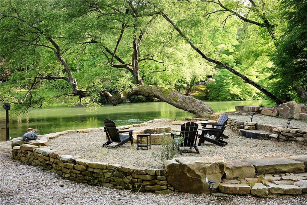 2 & 2a Weymans Way Blue Ridge, GA 30513 - Photo 11 of 34 a view of a lake with a yard table and chairs