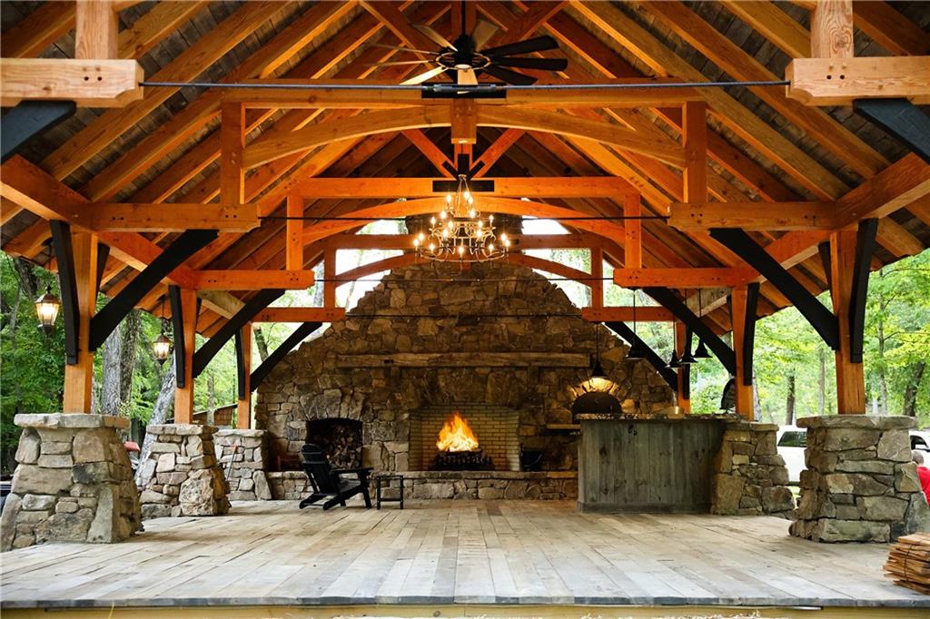 2 & 2a Weymans Way Blue Ridge, GA 30513 - Photo 29 of 34 a view of a patio with table and chairs with wooden floor and fence