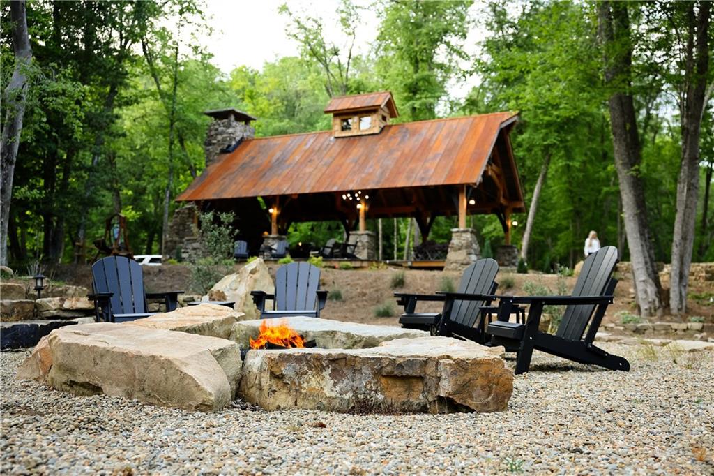 2 & 2a Weymans Way Blue Ridge, GA 30513 - Photo 30 of 34 a view of a patio with table and chairs under an umbrella