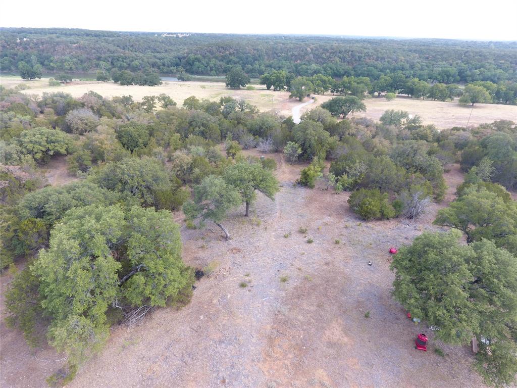Tbd Big Bnd Road Mineral Wells, TX 76067 - Photo 5 of 17 a view of a dry yard with trees