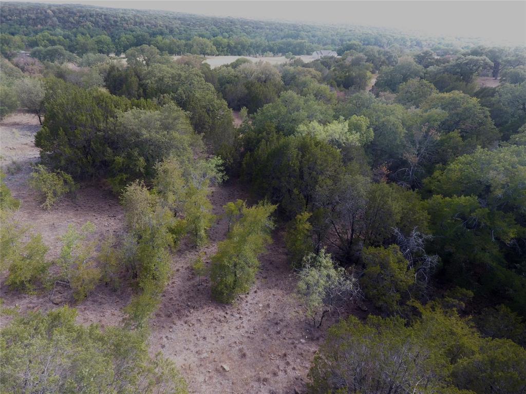 Tbd Big Bnd Road Mineral Wells, TX 76067 - Photo 9 of 17 an aerial view of residential house with outdoor space and trees all around