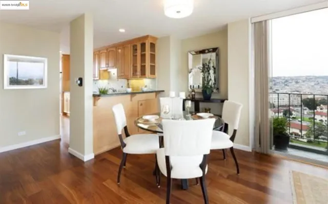 a view of a dining room with furniture window and wooden floor