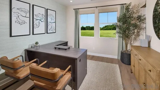 a view of a livingroom with furniture and front door