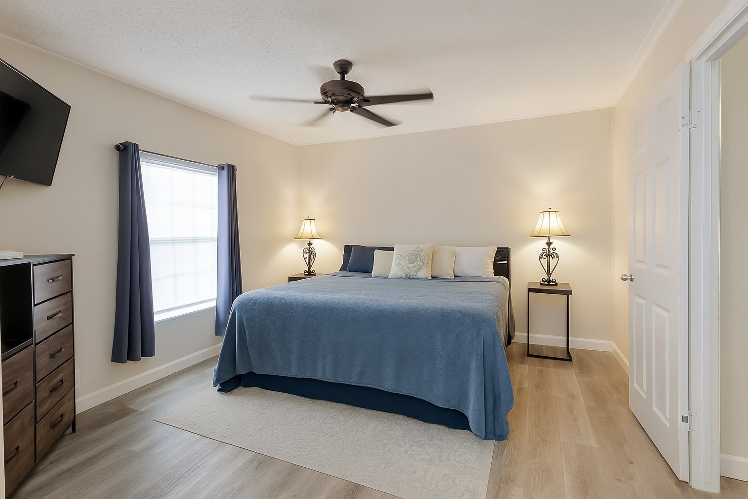 339 Old Flatwoods School Road Linden, TN 37096 - Photo 12 of 21 a bedroom with a bed and a flat tv screen on dresser