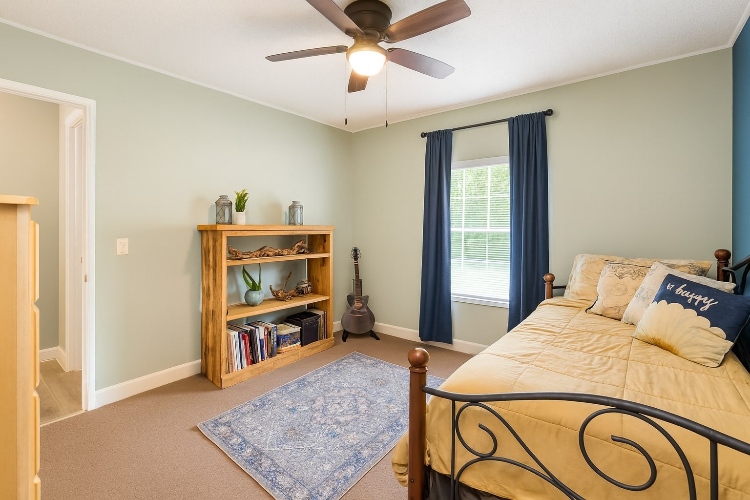 339 Old Flatwoods School Road Linden, TN 37096 - Photo 15 of 21 a bedroom with a bed and a bookshelf