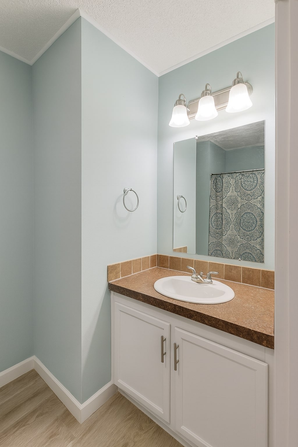 339 Old Flatwoods School Road Linden, TN 37096 - Photo 18 of 21 a bathroom with a granite countertop sink and a mirror