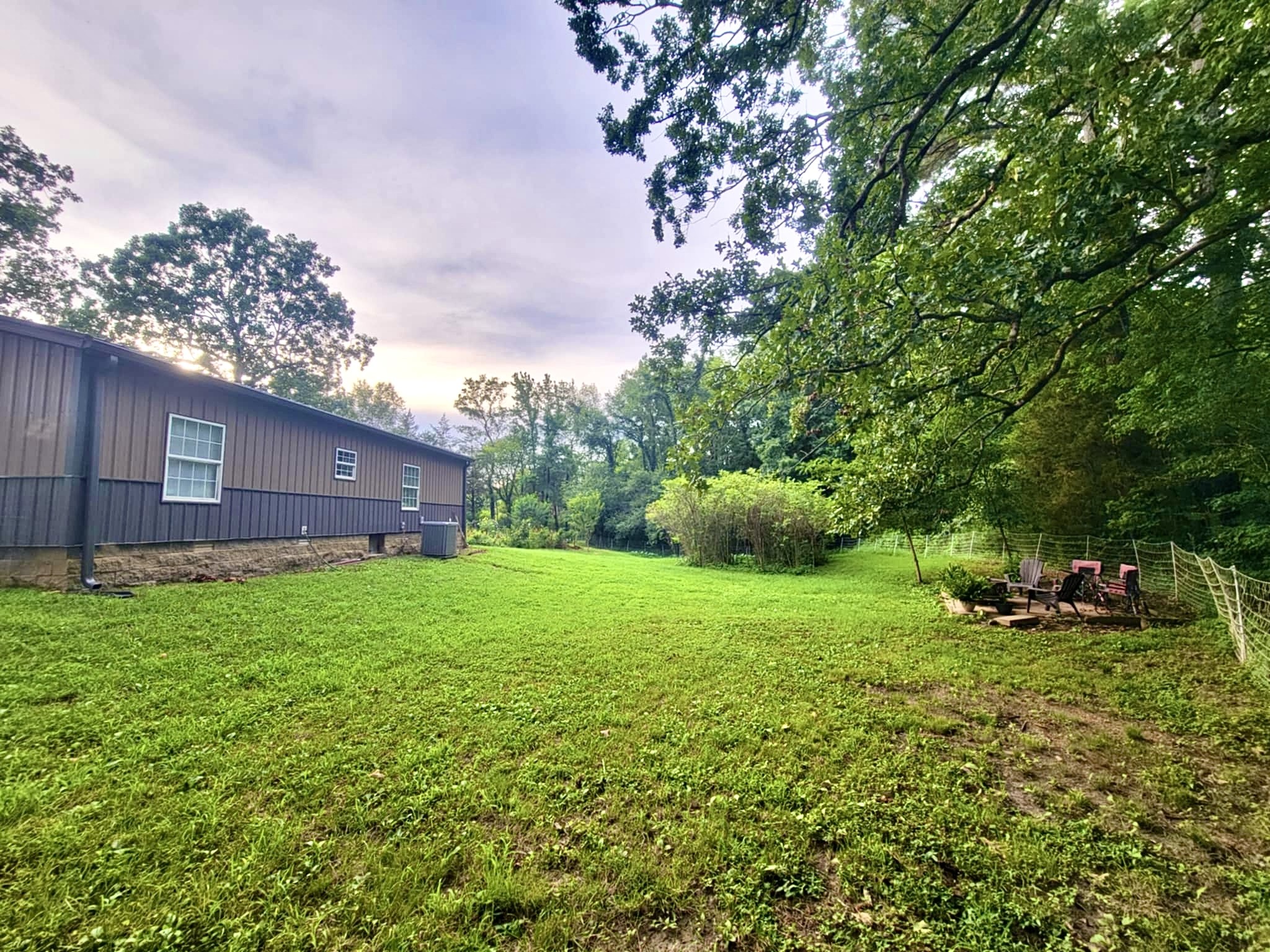 339 Old Flatwoods School Road Linden, TN 37096 - Photo 5 of 21 a backyard of a house with lots of green space