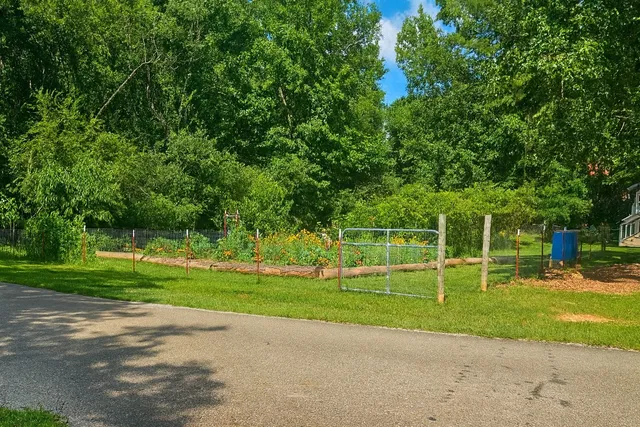 a front view of a house with a big yard