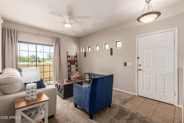 a living room with furniture and a window