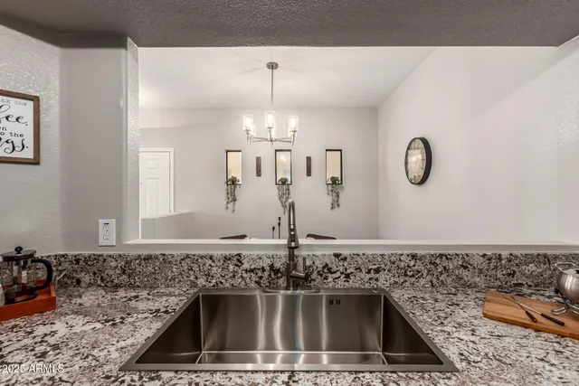 a kitchen with a sink and a stove