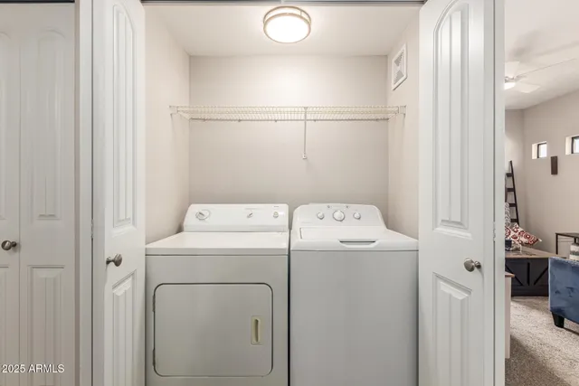 a utility room with dryer and washer