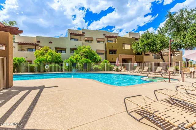 a view of a swimming pool with a patio