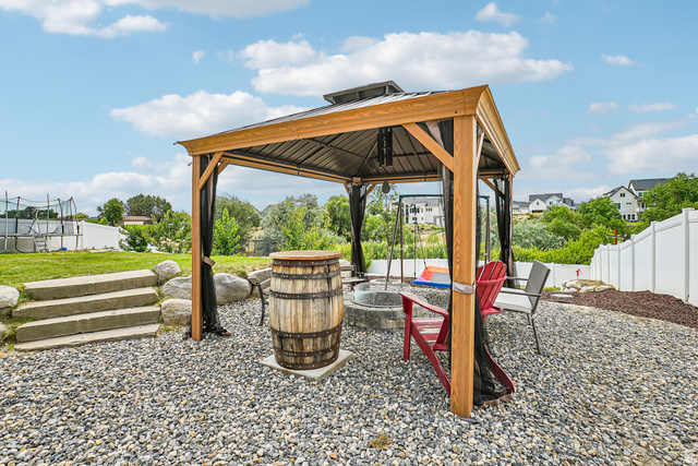 203 North 1900th Street West Mapleton, UT 84664 - Photo 40 of 48 Outdoor living area featuring a wood-frame gazebo with a metal roof