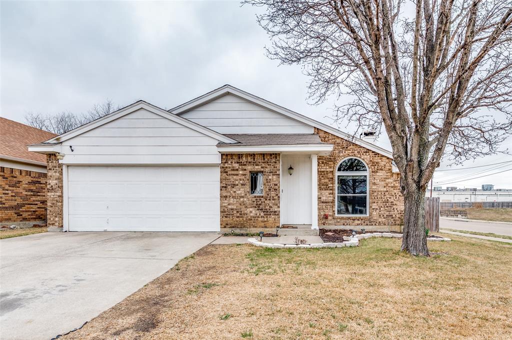 7741 Misty Ridge Drive North Fort Worth, TX 76137 - Photo 1 of 1 a front view of a house with a yard and garage