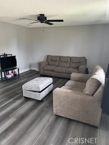 21115 Geronimo Road Apple Valley, CA 92308 - Photo 2 of 10 a living room with furniture and a flat screen tv