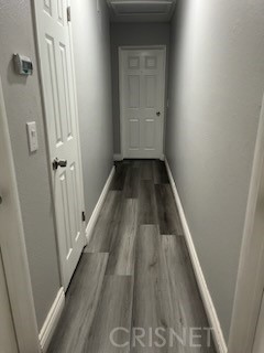 21115 Geronimo Road Apple Valley, CA 92308 - Photo 8 of 10 a view of a hallway with wooden floor and staircase
