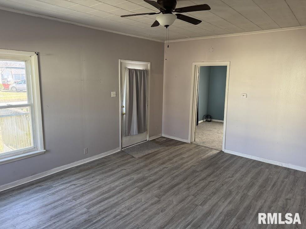 205 North State Street Christopher, IL 62822 - Photo 6 of 15 a view of an empty room with wooden floor and a window