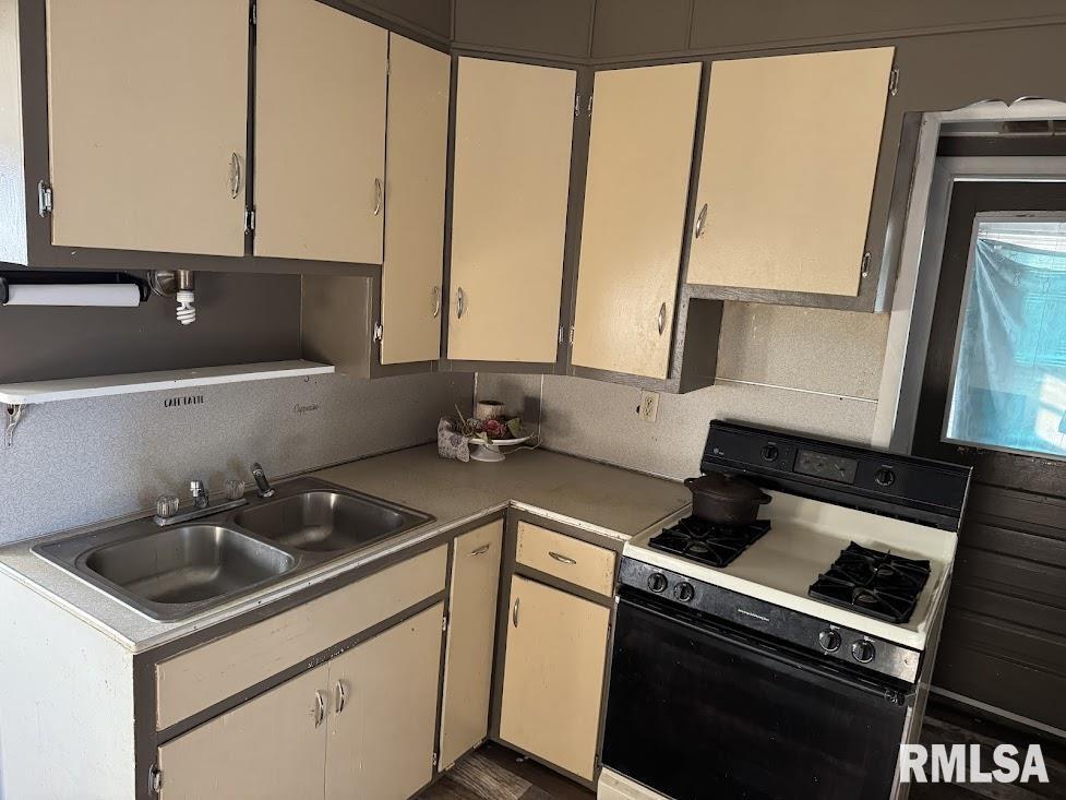 205 North State Street Christopher, IL 62822 - Photo 8 of 15 a kitchen that has a sink a stove and a microwave