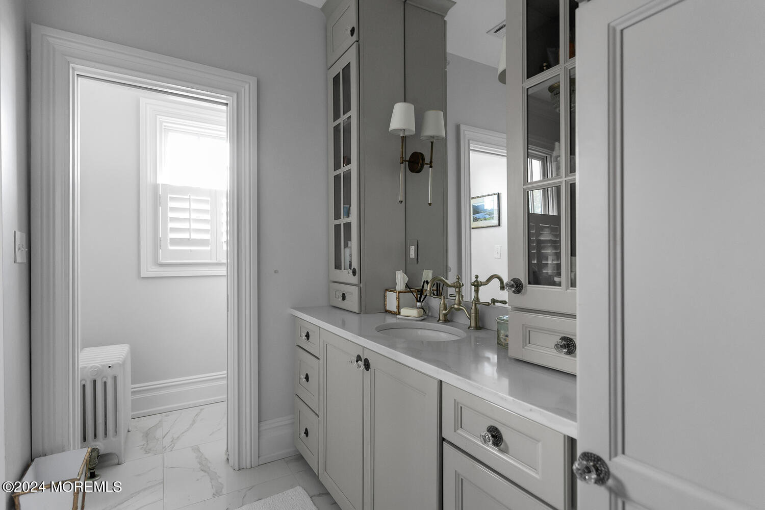 109 Washington Avenue Spring Lake, NJ 07762 - Photo 33 of 72 a bathroom with a double vanity sink a toilet and a mirror