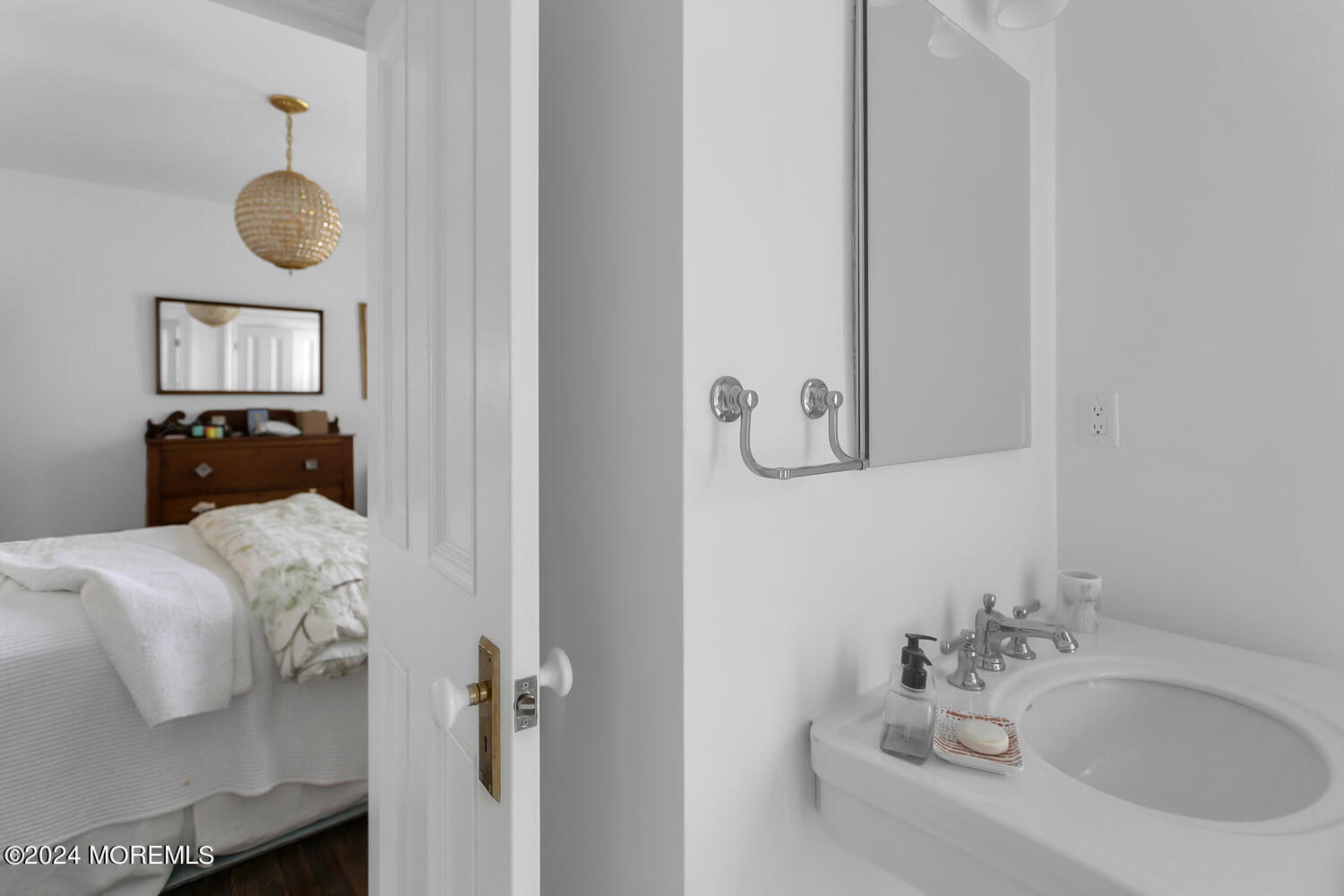 109 Washington Avenue Spring Lake, NJ 07762 - Photo 43 of 72 a bathroom with a sink and mirror