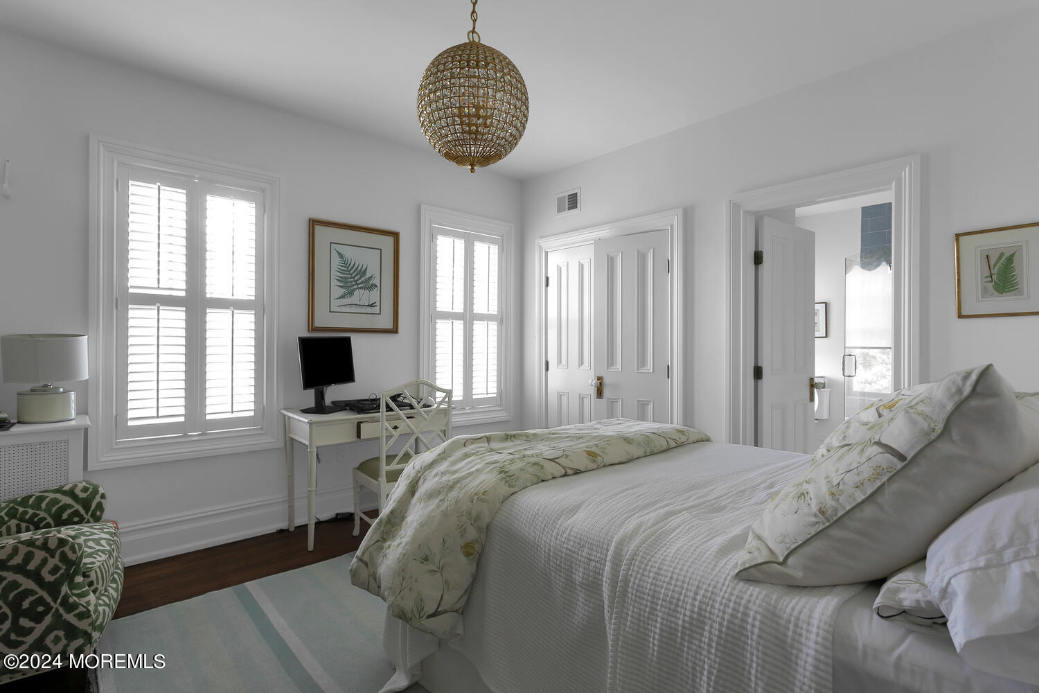 109 Washington Avenue Spring Lake, NJ 07762 - Photo 45 of 72 a bedroom with a bed and a chandelier