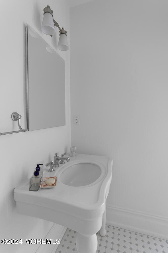 109 Washington Avenue Spring Lake, NJ 07762 - Photo 46 of 72 a bathroom with a sink and a mirror