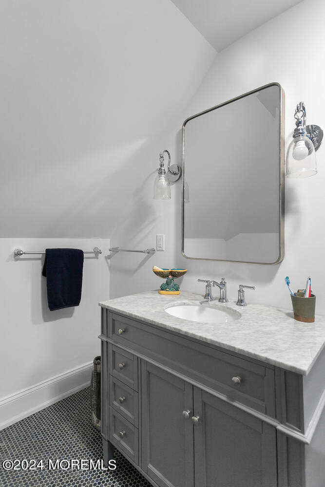 109 Washington Avenue Spring Lake, NJ 07762 - Photo 48 of 72 a bathroom with a sink and a mirror