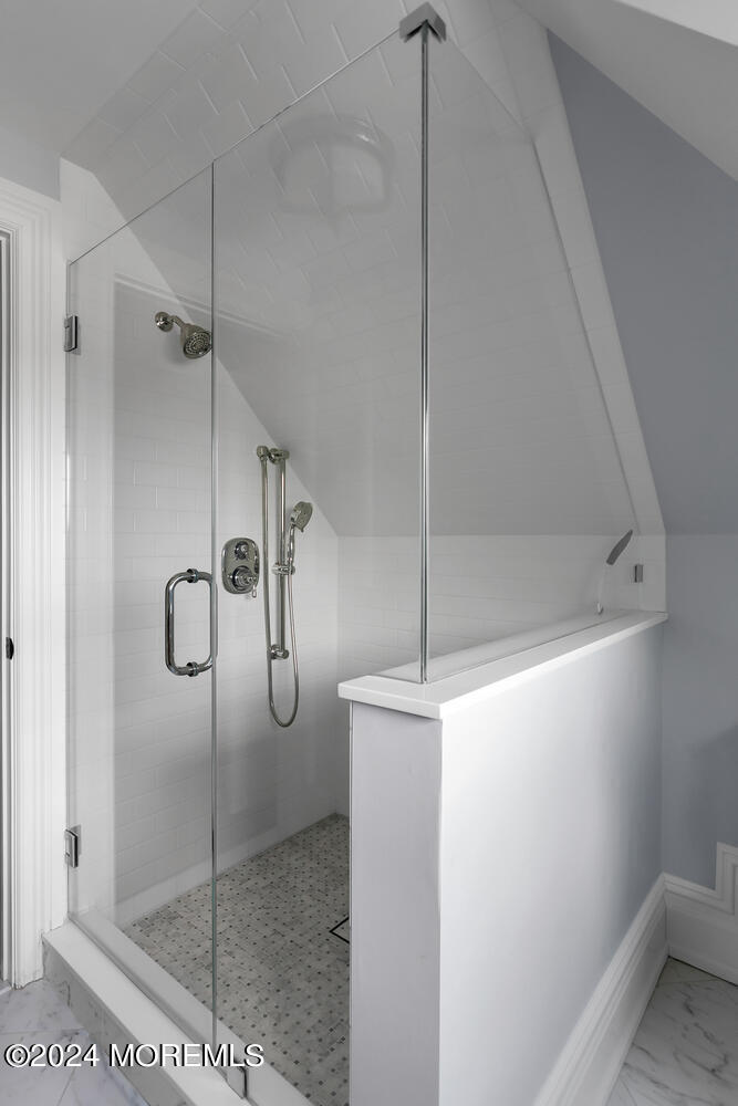 109 Washington Avenue Spring Lake, NJ 07762 - Photo 49 of 72 a bathroom with a glass shower door