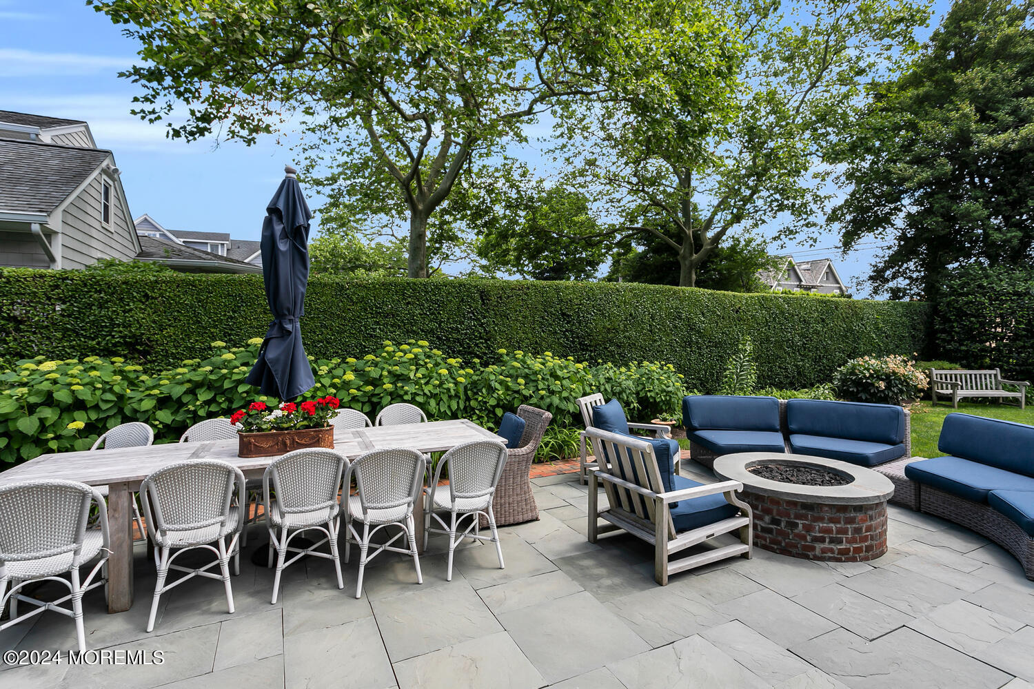 109 Washington Avenue Spring Lake, NJ 07762 - Photo 63 of 72 a view of a patio with couches potted plants and a big yard