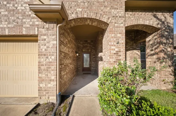 a front view of a house with a garage