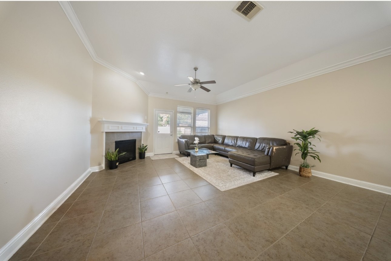 6130 Flagg Ranch Drive Spring, TX 77388 - Photo 7 of 15 a living room with furniture and a fireplace