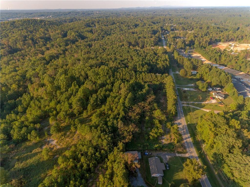 1428 Bobo Road Dallas, GA 30132 - Photo 4 of 12 an aerial view of residential houses with outdoor space