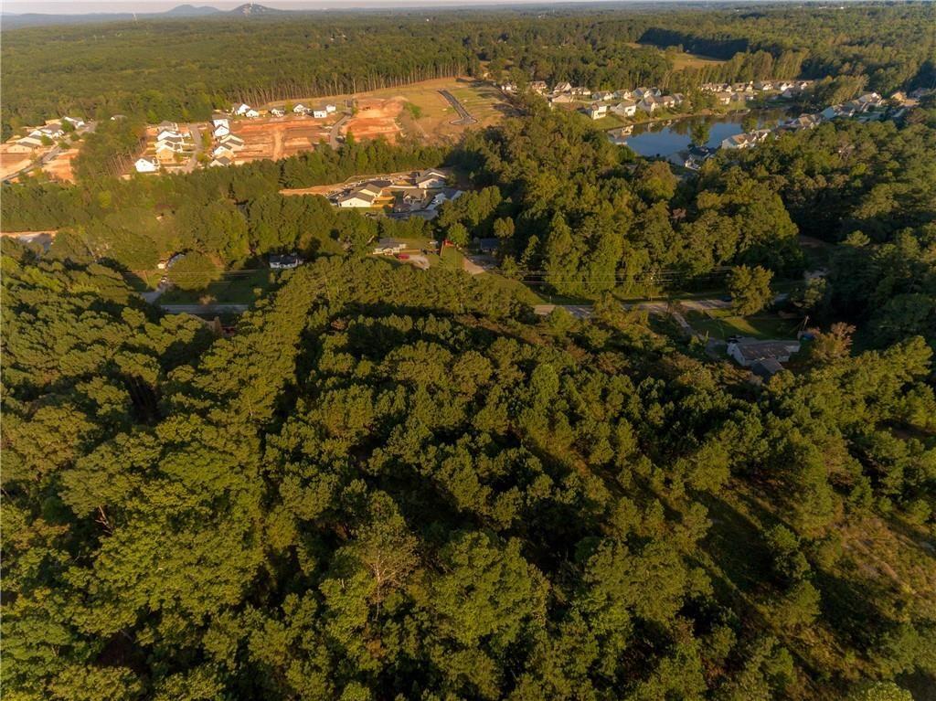 1428 Bobo Road Dallas, GA 30132 - Photo 7 of 12 an aerial view of residential houses with outdoor space and trees