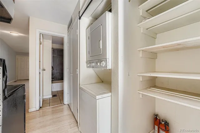 a view of a house with a wooden deck