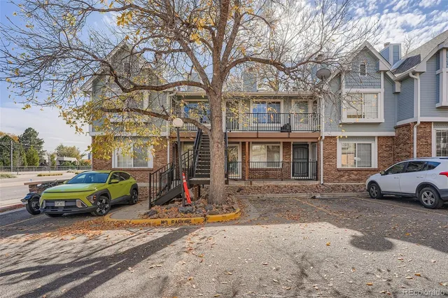 a car parked in front of a brick building