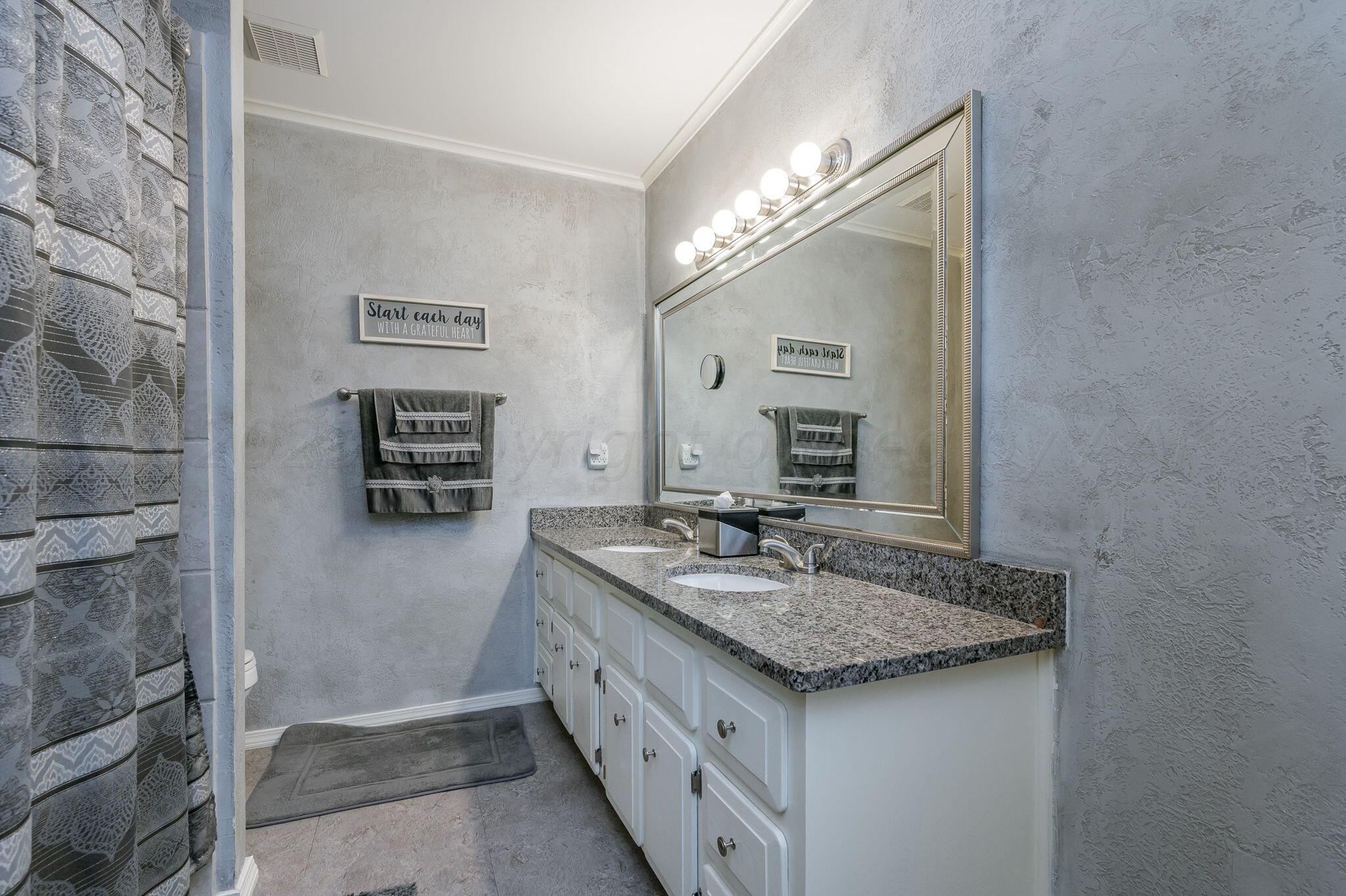 7004 Hurst Street Amarillo, TX 79109 - Photo 11 of 18 Master Bathroom