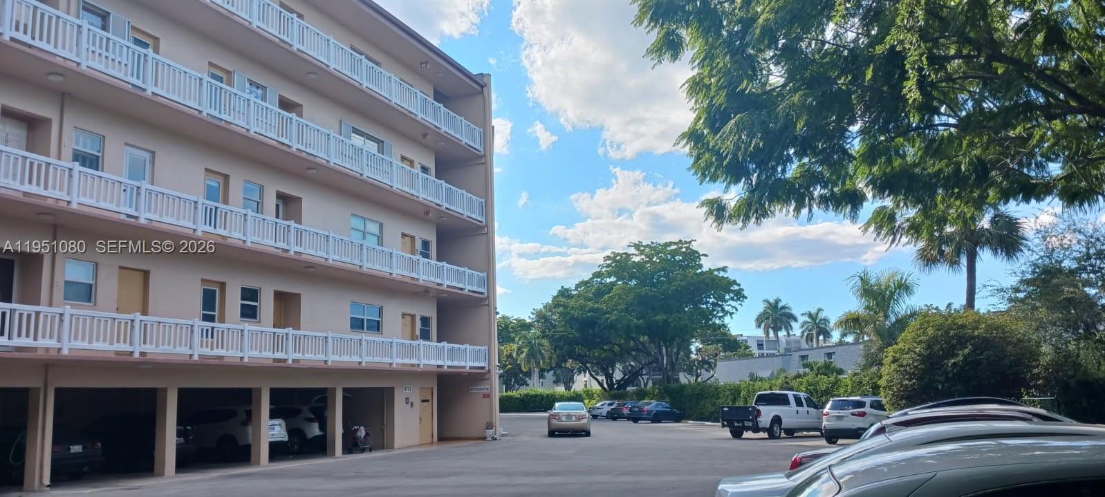 6731 Cypress Road, Unit 310 Plantation, FL 33317 - Photo 11 of 16 a view of a building with a street