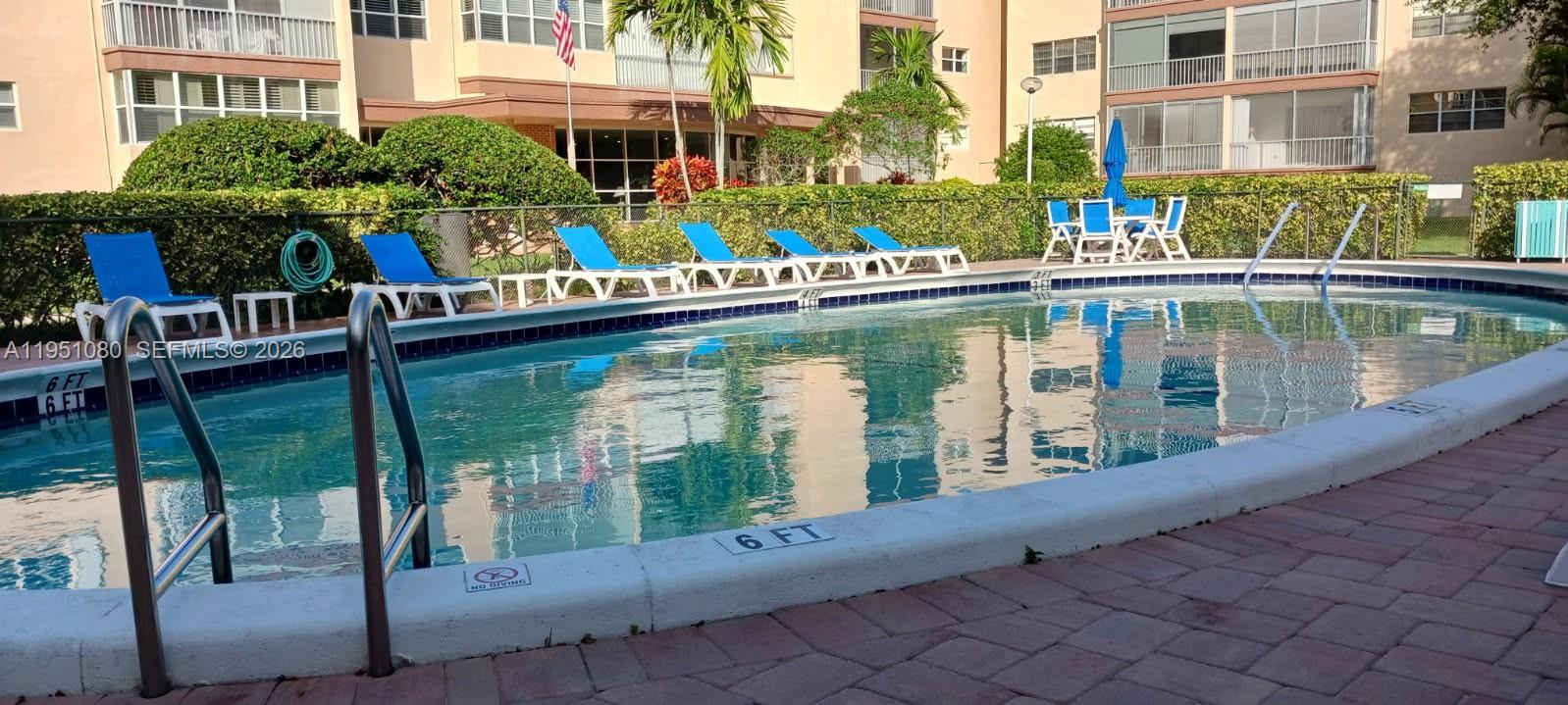 6731 Cypress Road, Unit 310 Plantation, FL 33317 - Photo 13 of 16 a balcony with couple of glass top table and chairs