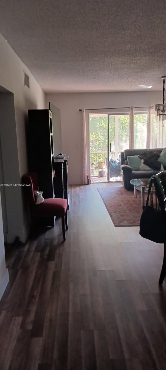 6731 Cypress Road, Unit 310 Plantation, FL 33317 - Photo 3 of 16 a living room with furniture and a flat screen tv