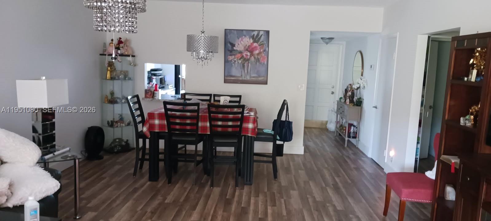 6731 Cypress Road, Unit 310 Plantation, FL 33317 - Photo 4 of 16 a view of a dining room with furniture and wooden floor