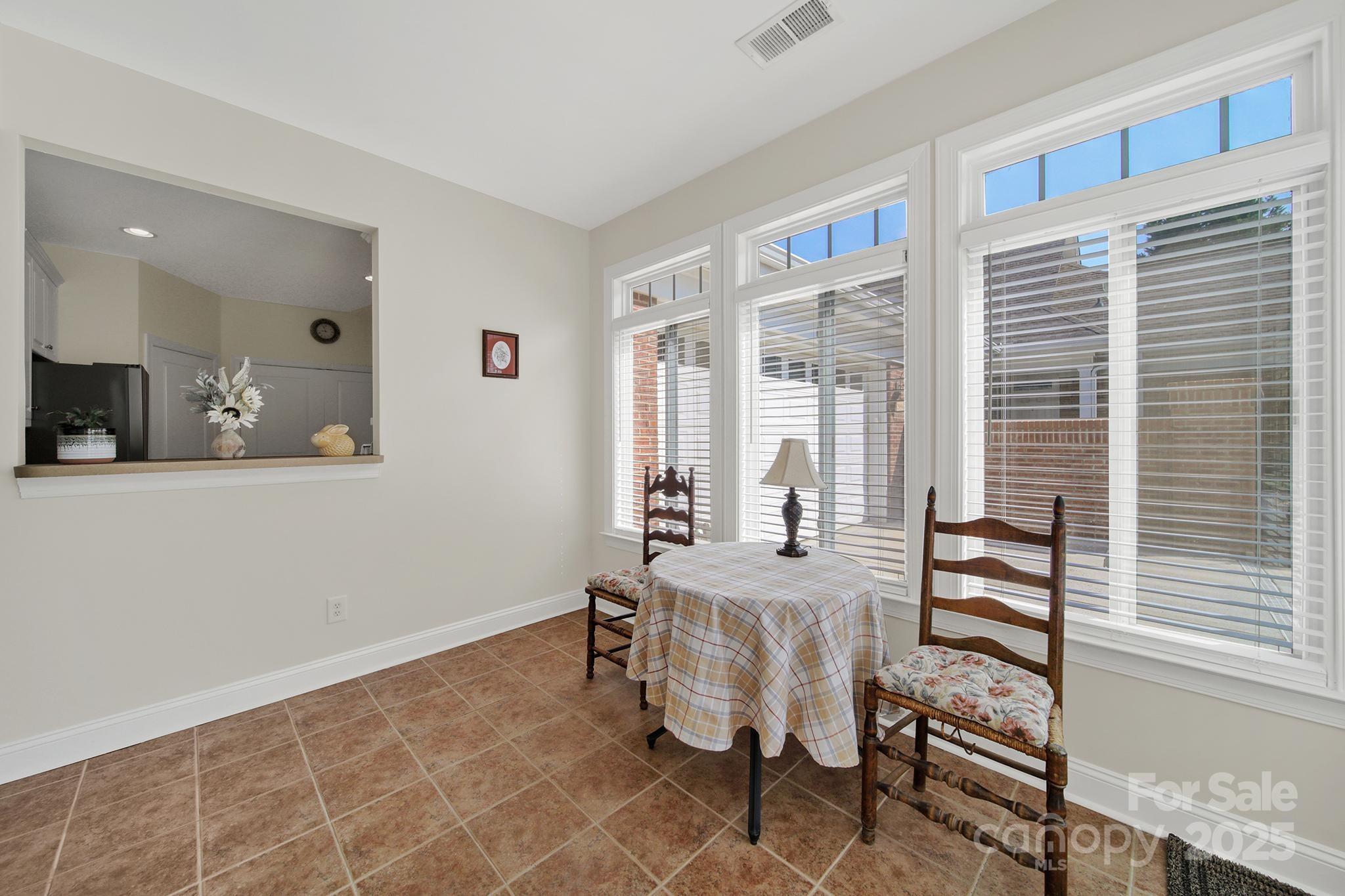 2959 Bellasera Way Matthews, NC 28105 - Photo 11 of 30 a bedroom with furniture and a large window