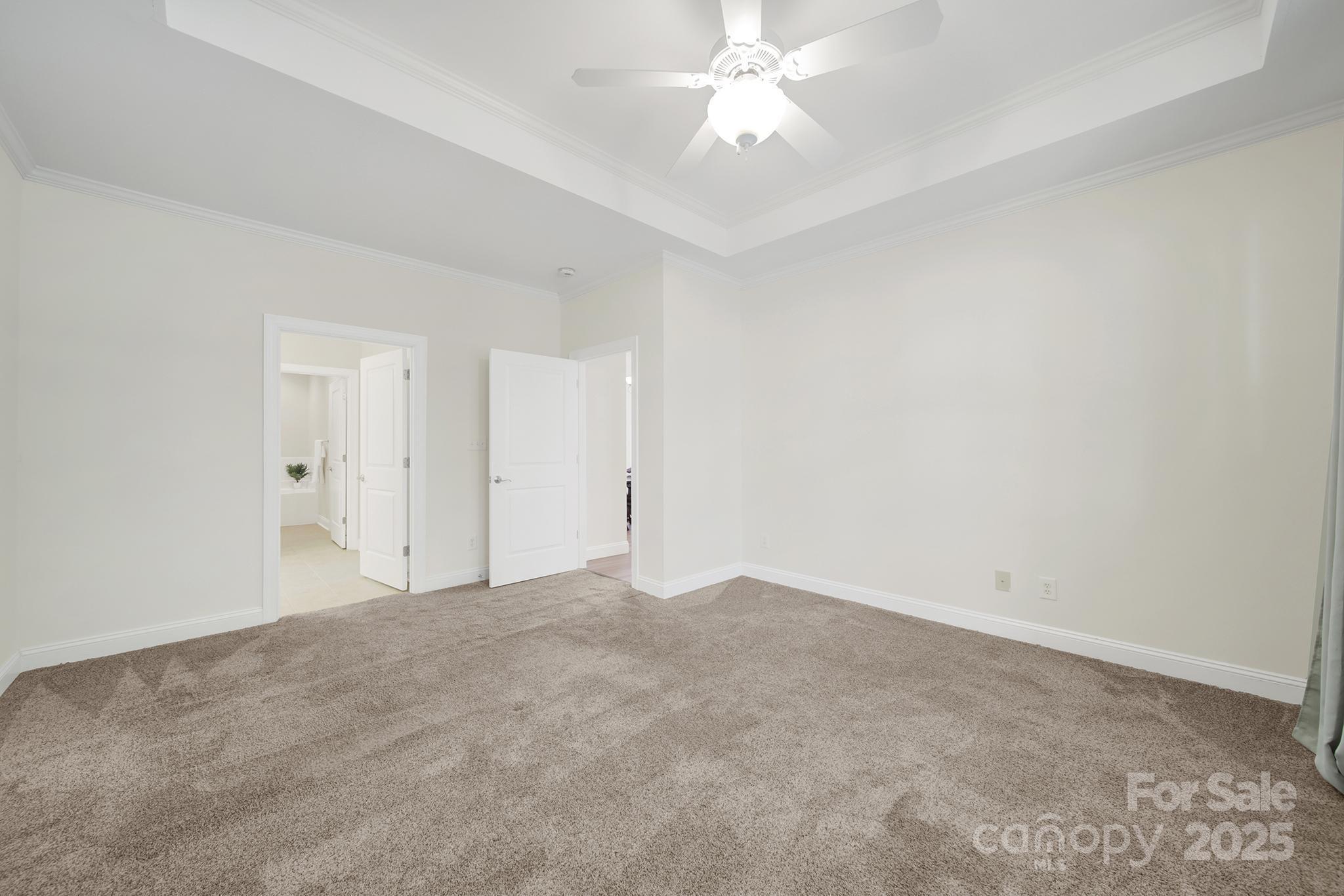 2959 Bellasera Way Matthews, NC 28105 - Photo 15 of 30 a view of an empty room with a chandelier fan