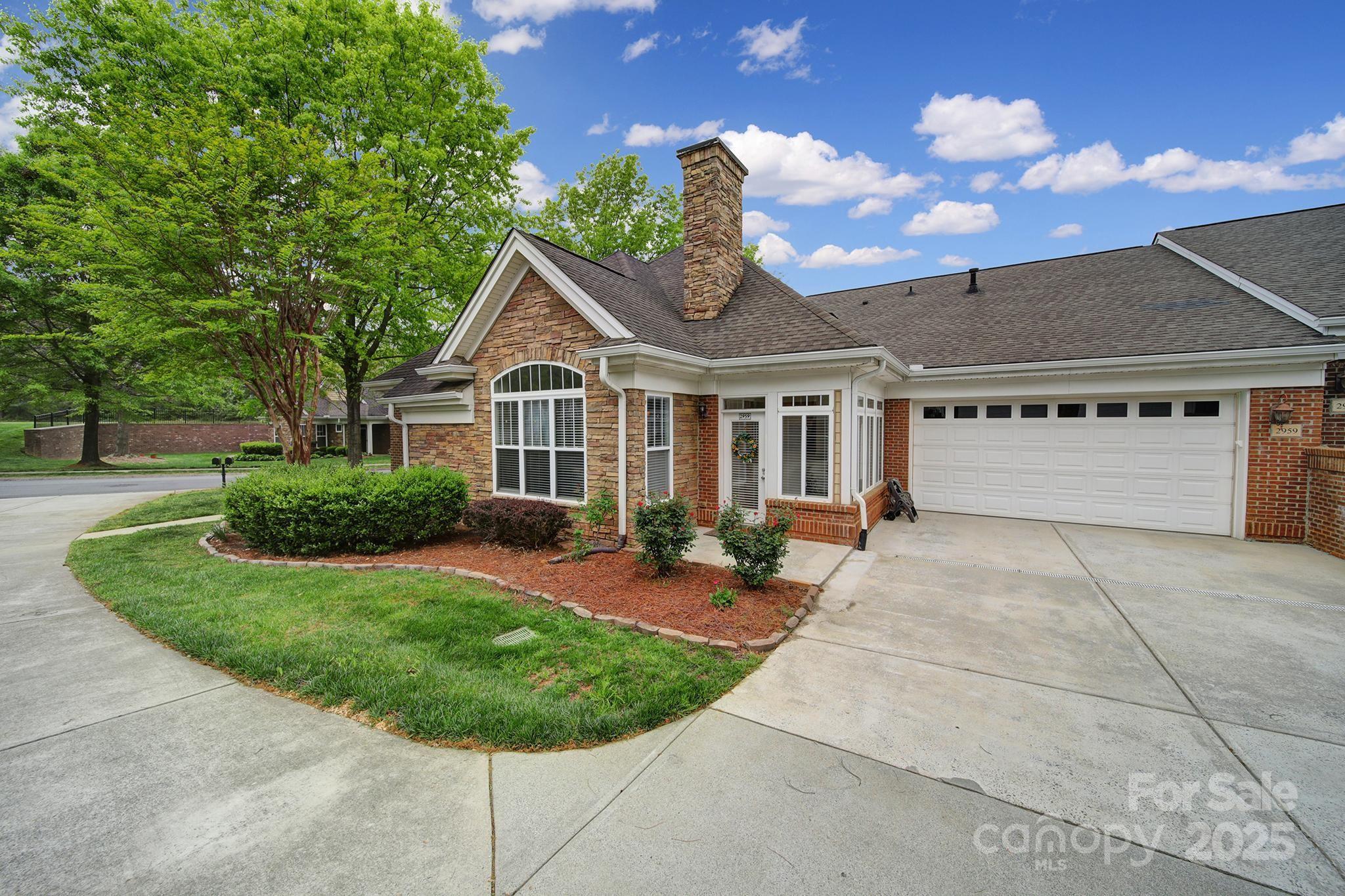 2959 Bellasera Way Matthews, NC 28105 - Photo 2 of 30 a house view with a garden space